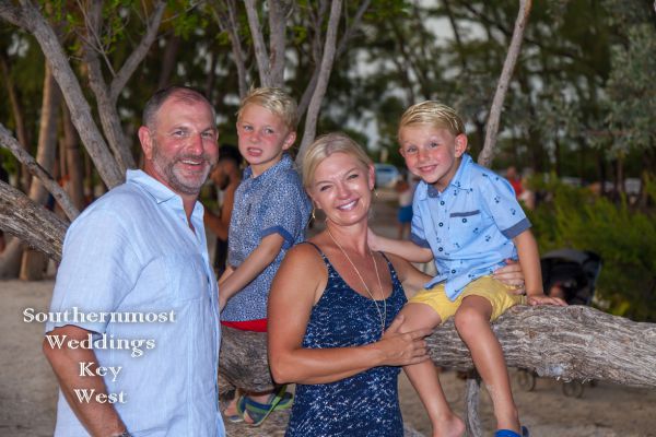 Family poses for photos by Southernmost Weddings Key West