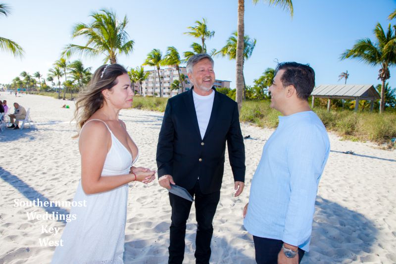 Wedding couple getting married on Smathers Beach in Key West, Florida by Southernmost Weddings Key West