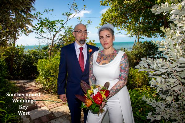 Wedding couple poses for photos by Southernmost Weddings Key West
