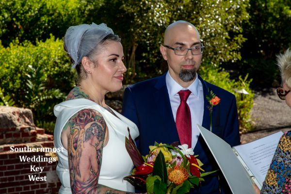 Wedding couple say their wedding vows in the West Martello Gardens