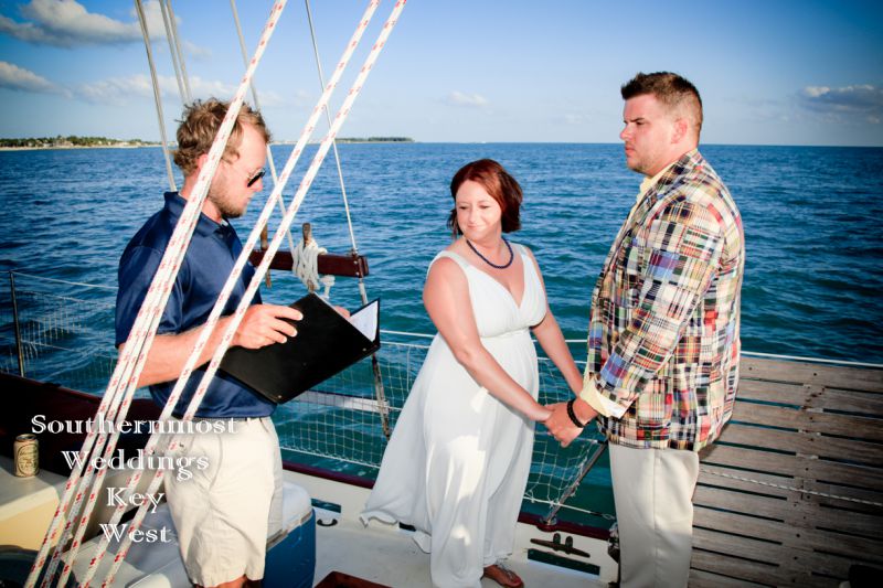 Wedding Couple getting married on a sailboat off the coast of Key West, Florida by Southernmost Weddings