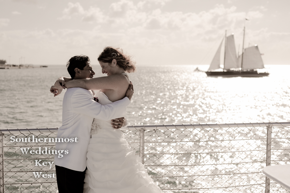 Couple getting married on a sailboat by Southernmost Weddings Key West