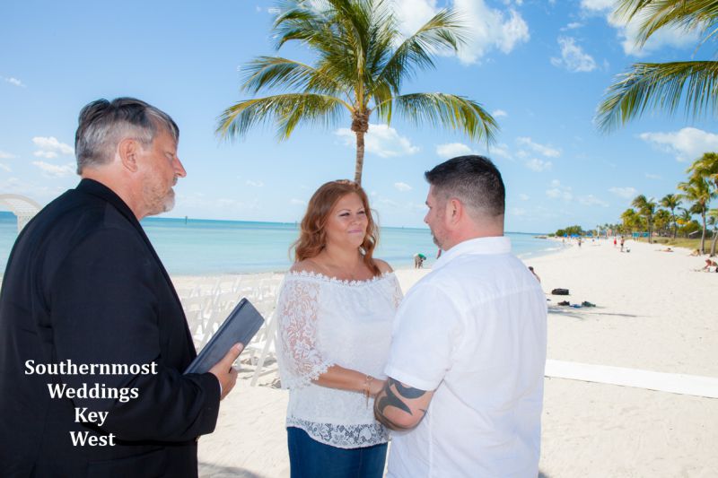Wedding couple getting married on Smathers Beach by Southernmost Weddings Key West