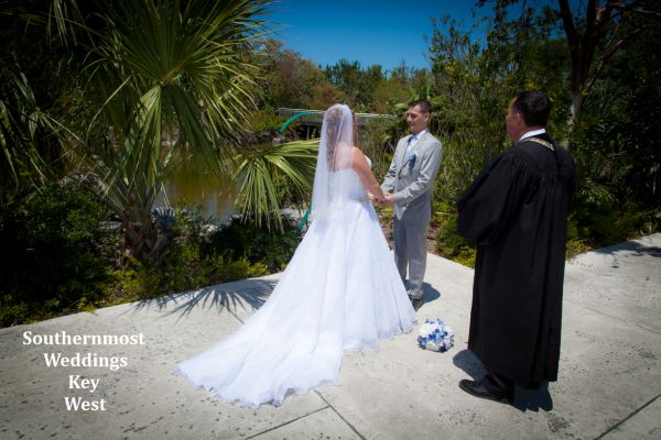 Wedding officiant from Southernmost Wedding performs a ceremony at the Key West Tropical Forest & Botanical Garden