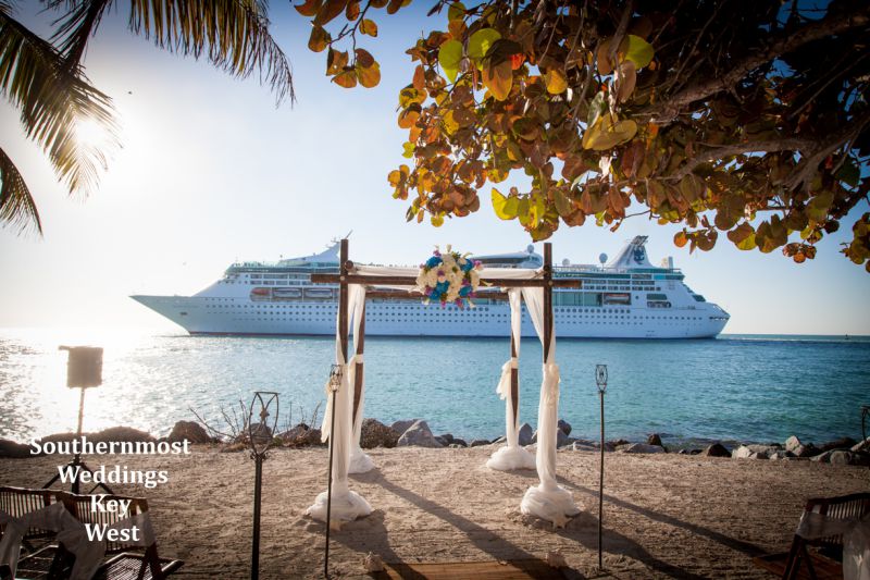 A cruise ship passes by a wedding at Ft. Zachary Taylor - Image by Southernmost Weddings