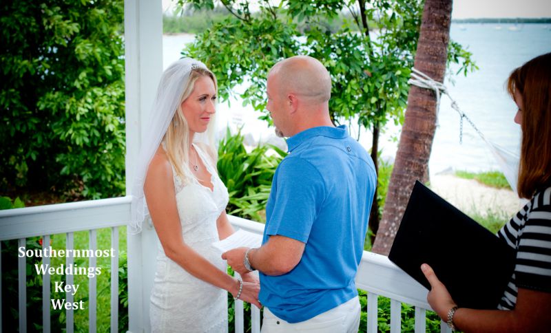 Wedding couple say their vows during their wedding by Southernmost Weddings Key West