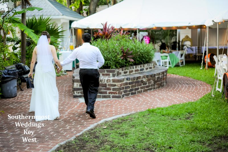 Bride & Groom take a walk in the Oldest House & Museum Tropical Garden after their wedding.