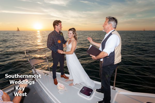 Wedding officiant from Southernmost Weddings performs a sunset ceremony on a private catamaran