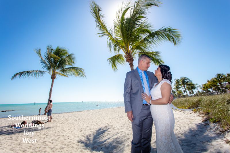Wedding couple getting married on Smathers Beach in Key West, Florida by Southernmost Weddings Key West