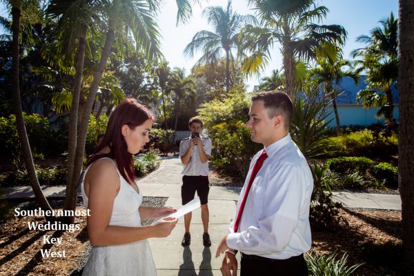 Wedding officiant from Southernmost Wedding performs a ceremony in the Truman Annex Tropical Pocket Garden