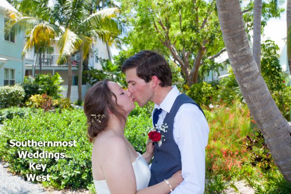Wedding couple kisses after getting married by Southernmost Weddings