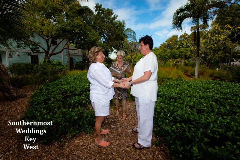Wedding officiate from Southernmost Weddings Key West performs a ceremony in the Truman Annex Butterfly Garden 