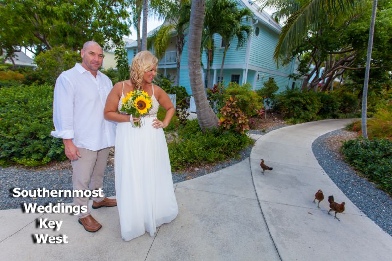 Wedding couple pose for photos in the Truman Annex Butterfly Garden after their Elopement planned by Southernmost Wedding Key West