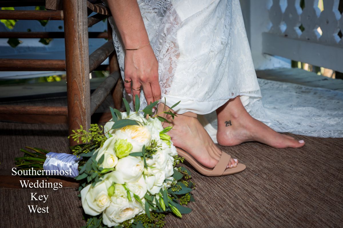 Brides mother helping here get ready - Image by Southernmost Weddings
